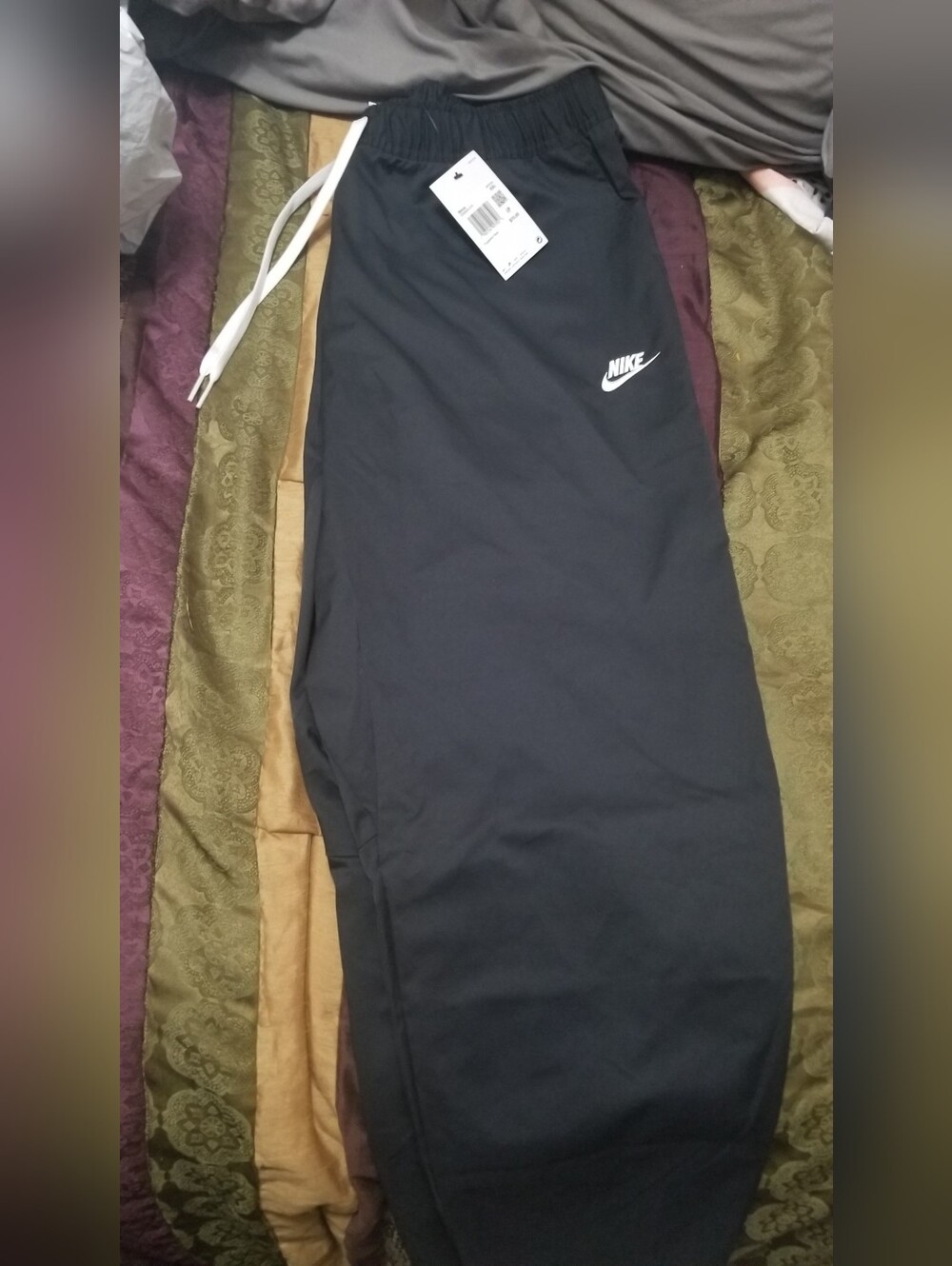 Nike Black Track Pants with White Swoosh Logo